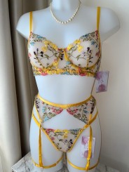 Three-piece sexy lace lingerie set in yellow color featuring floral design