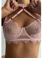 Three-piece sexy lace lingerie set in light pink color featuring suspender with feathers and neck accessory.